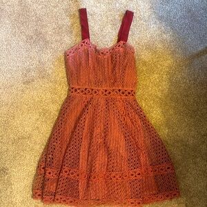INA beautiful lace woven dress in a mauve color with ribbon straps. Fully lined